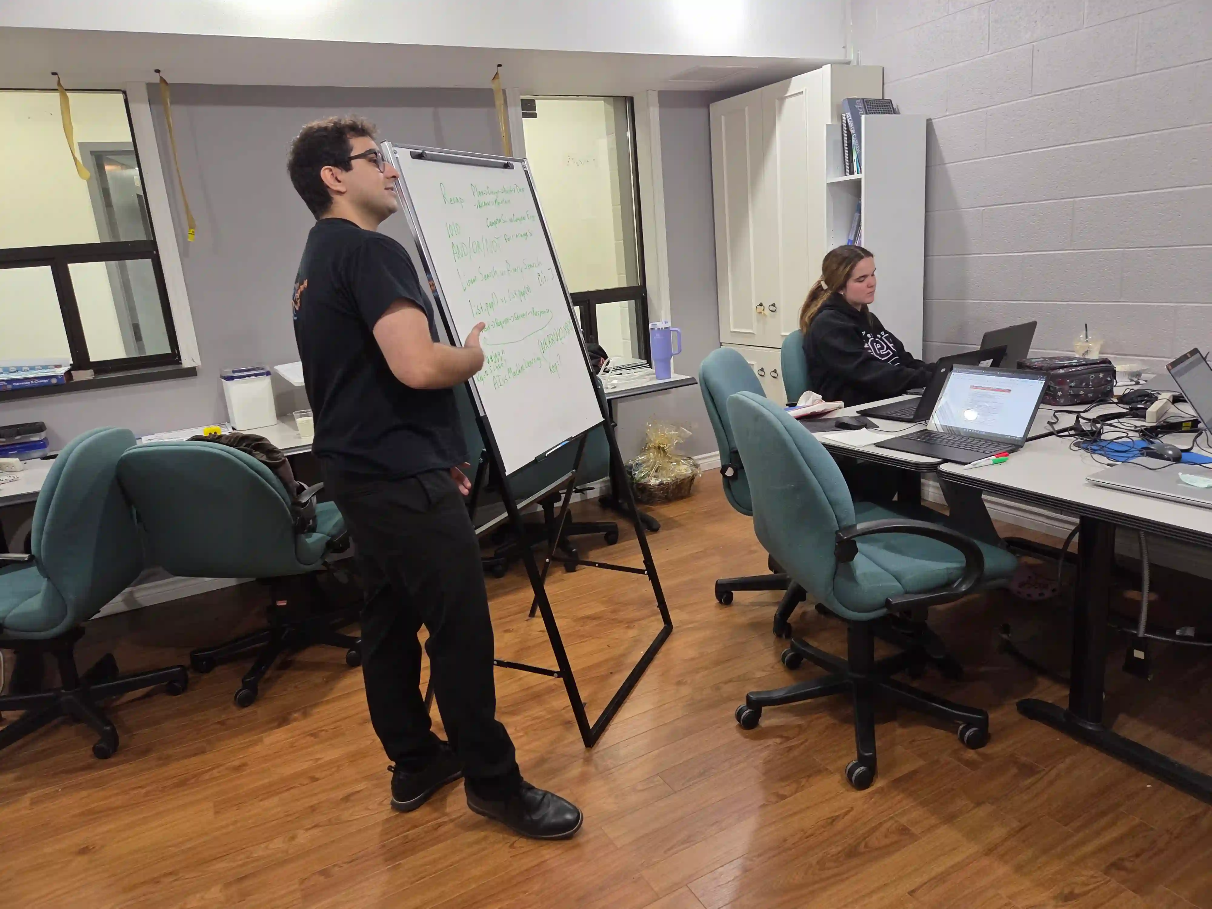 Computer science instructor teaching students during an ABLE and RP4K coding class